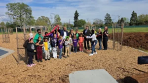 Students learn and work together in a school garden.